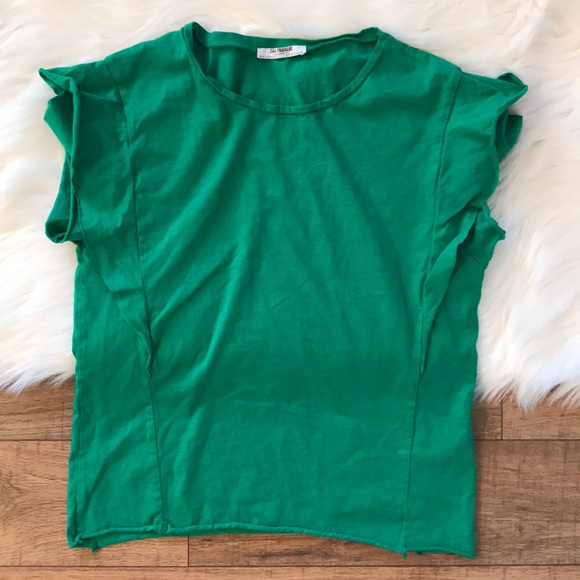 green ruffle shirt